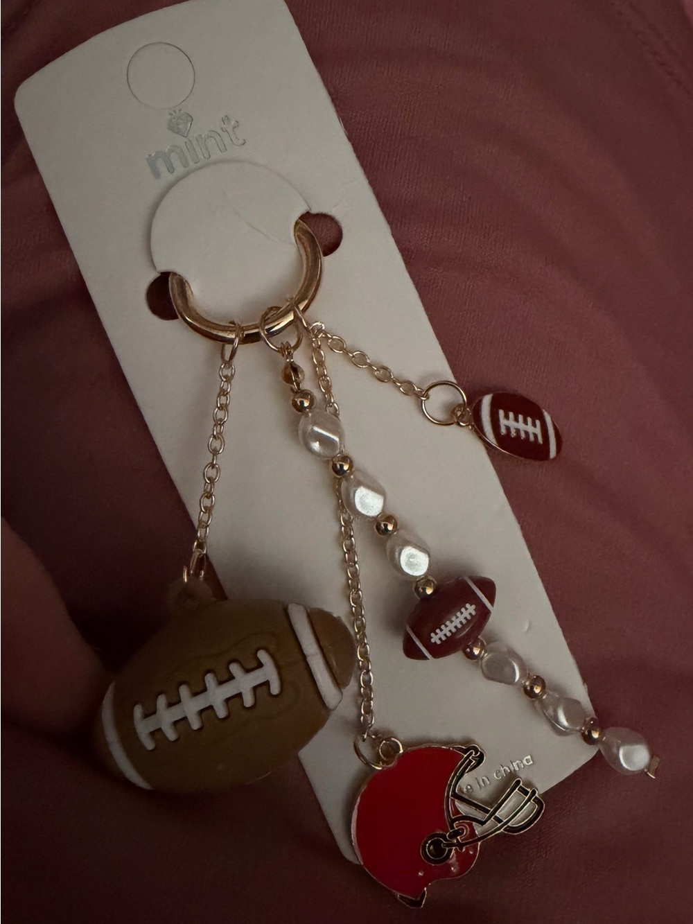 Mint Gold-Tone Football Charm Keychain with Red Helmet and Brown Footballs